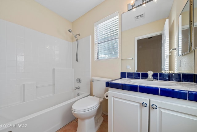 full bathroom with vanity, tile patterned flooring, washtub / shower combination, and toilet