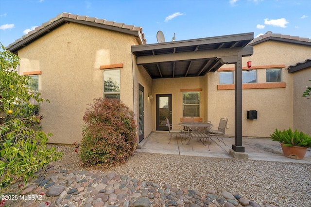 rear view of house with a patio area