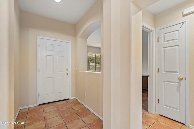 foyer featuring light tile patterned flooring