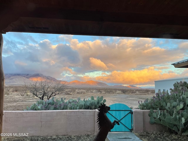 exterior space with a water and mountain view