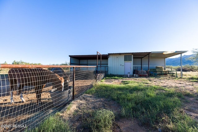 exterior space featuring an outbuilding