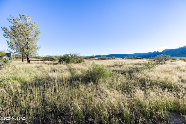 mountain view featuring a rural view