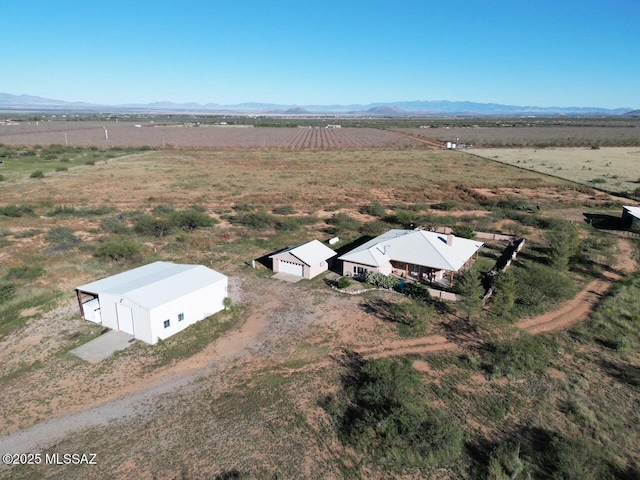 drone / aerial view with a mountain view and a rural view