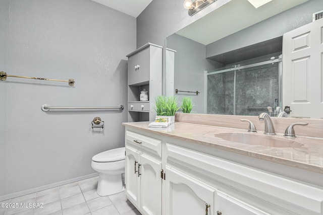 bathroom featuring vanity, tile patterned flooring, a shower with shower door, and toilet