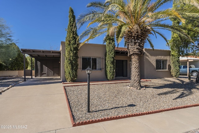 view of front of property featuring a carport