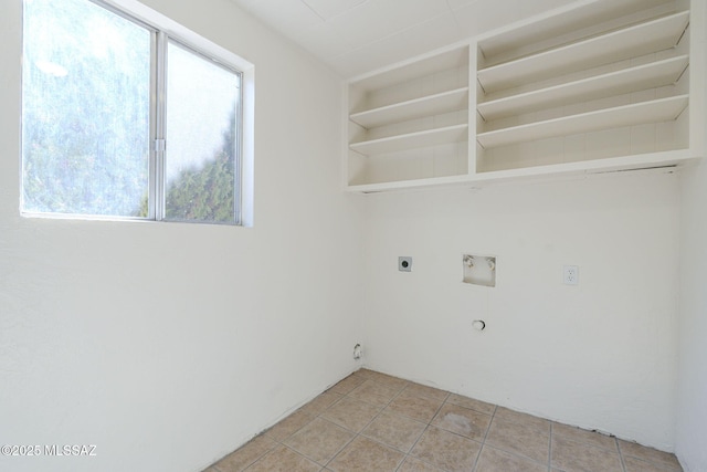 washroom featuring washer hookup, gas dryer hookup, hookup for an electric dryer, and a healthy amount of sunlight