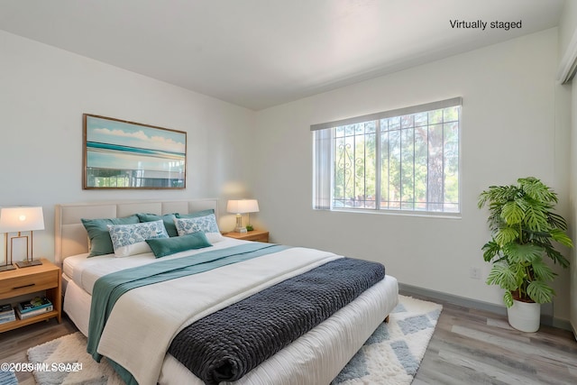 bedroom with light wood-type flooring