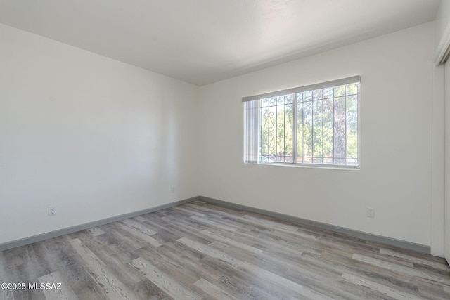 unfurnished room featuring light wood-type flooring