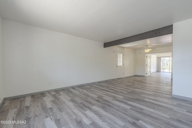 unfurnished room featuring ceiling fan, beam ceiling, and light hardwood / wood-style flooring