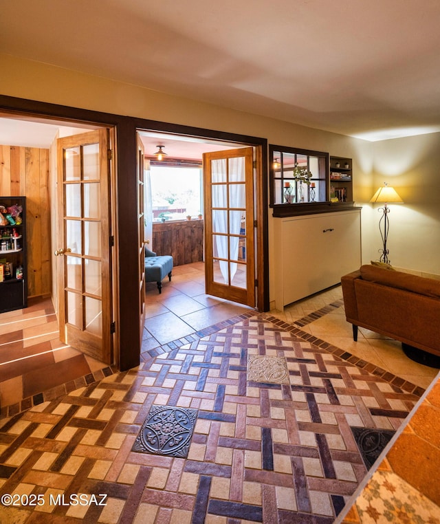 doorway to outside with french doors and tile patterned floors