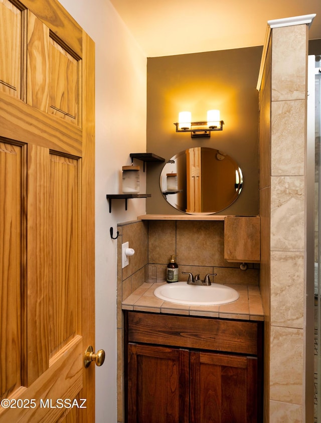 bathroom featuring decorative backsplash and vanity