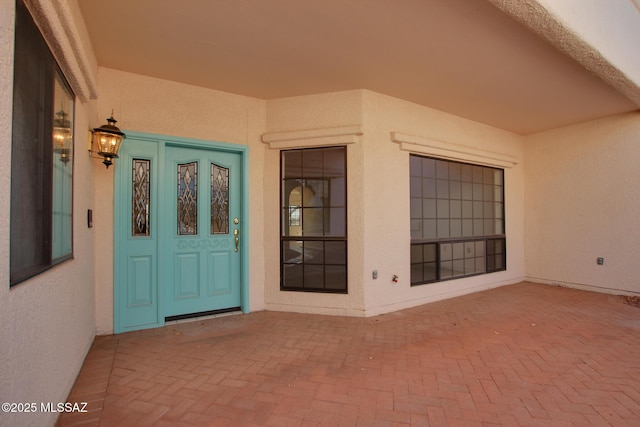 entrance to property with a patio area