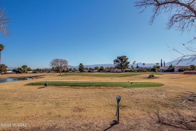 view of yard with a water and mountain view