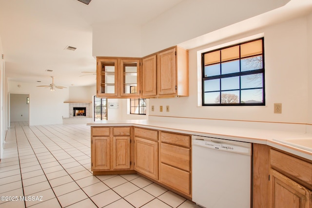 kitchen with dishwasher, light brown cabinetry, ceiling fan, and light tile patterned flooring