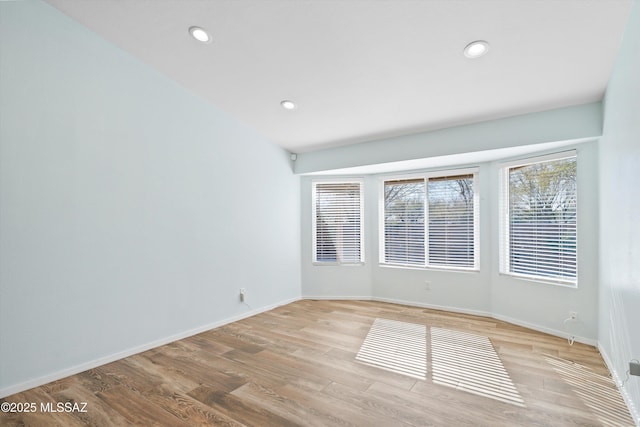 unfurnished room with light hardwood / wood-style flooring