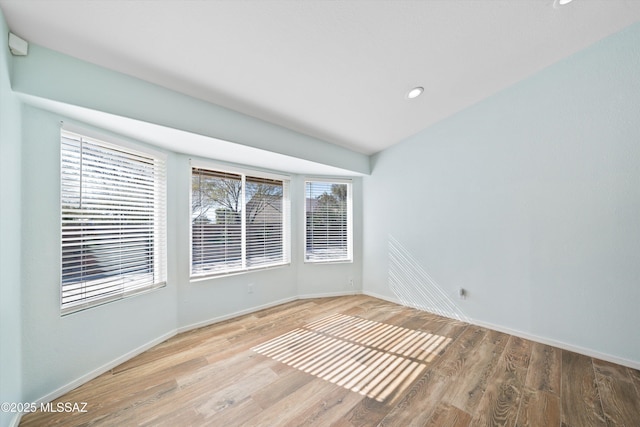 unfurnished room with light wood-type flooring