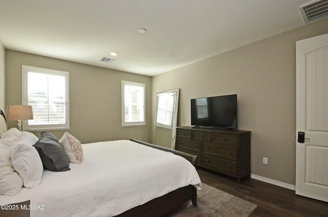 bedroom featuring dark hardwood / wood-style floors