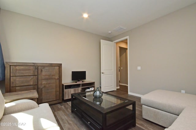 living room with dark hardwood / wood-style flooring