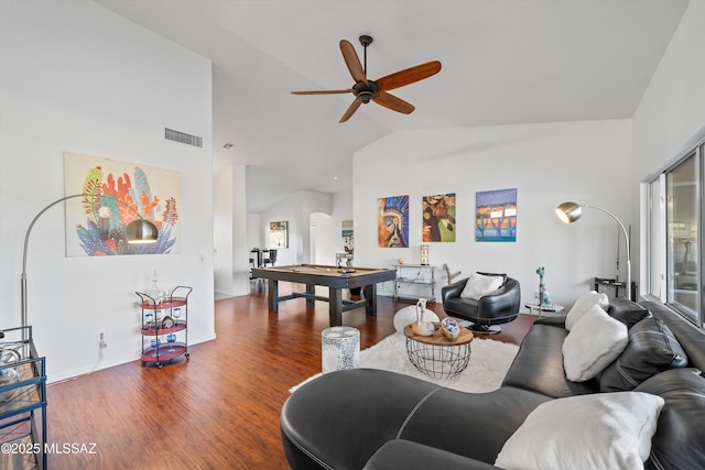 living room with ceiling fan, hardwood / wood-style flooring, and vaulted ceiling