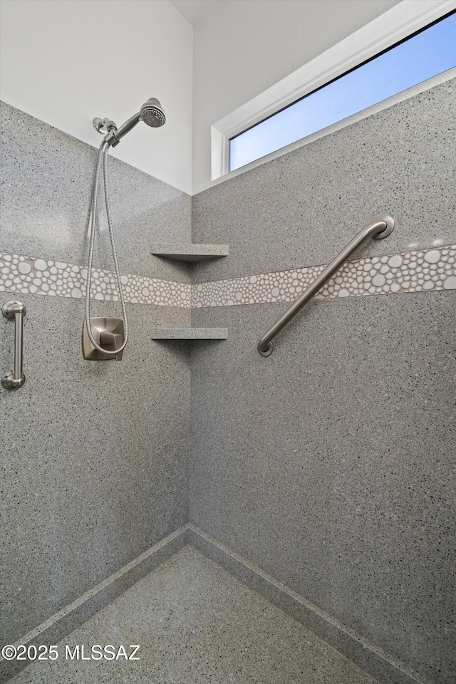 bathroom with tiled shower