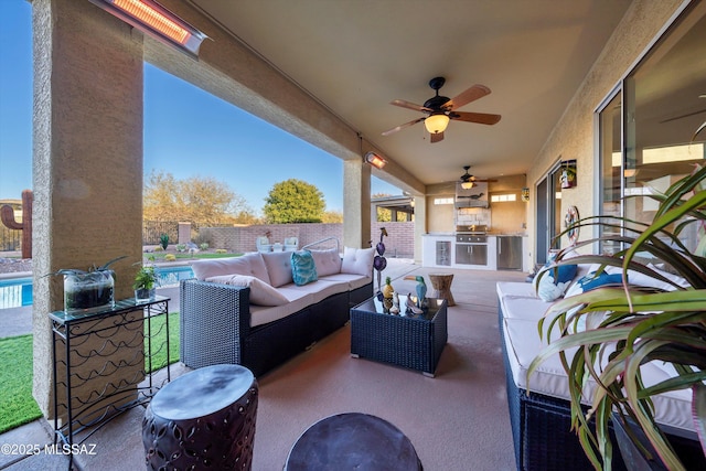 view of patio / terrace with exterior kitchen, a fenced in pool, an outdoor living space, and ceiling fan