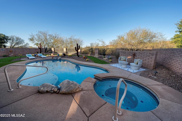 view of pool with an in ground hot tub and a patio area