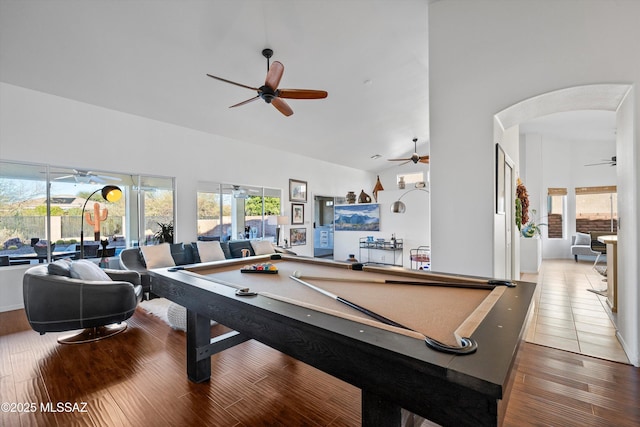 rec room with high vaulted ceiling, pool table, and hardwood / wood-style floors