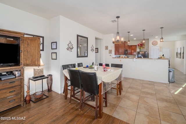 dining space with a notable chandelier