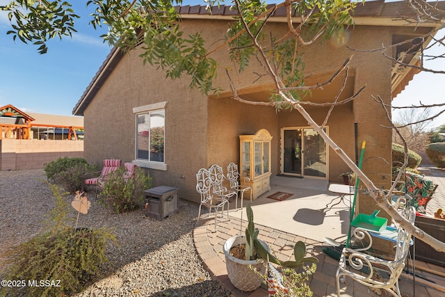 back of property with a patio area