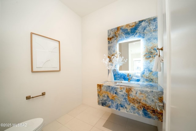 bathroom with sink, tile patterned floors, and toilet