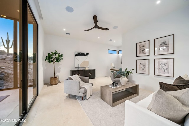 tiled living room featuring ceiling fan