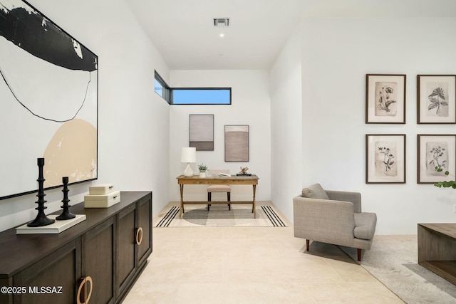 sitting room featuring light tile patterned flooring