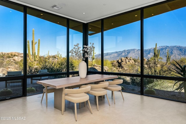 sunroom / solarium with a mountain view