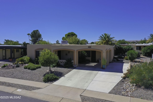 view of front of home with a carport