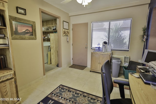 office featuring washer / dryer and ceiling fan