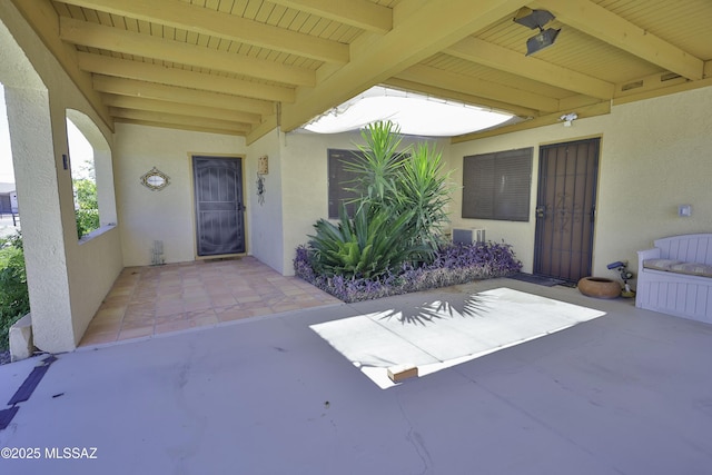 doorway to property featuring a patio