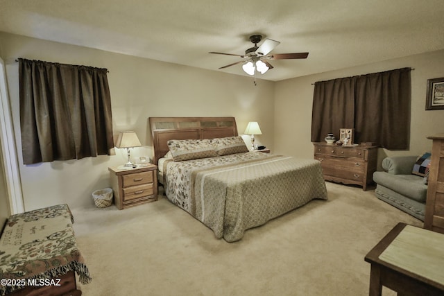 bedroom featuring ceiling fan and light colored carpet