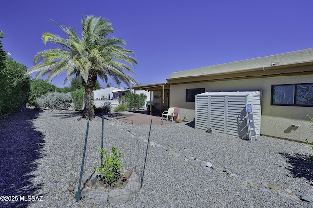 view of side of home featuring a patio area