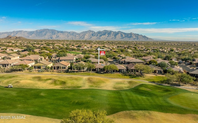 view of home's community with a mountain view, golf course view, and a residential view