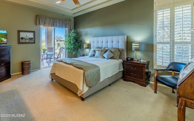 carpeted bedroom with access to exterior and baseboards