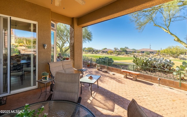 view of patio / terrace with outdoor dining space and fence