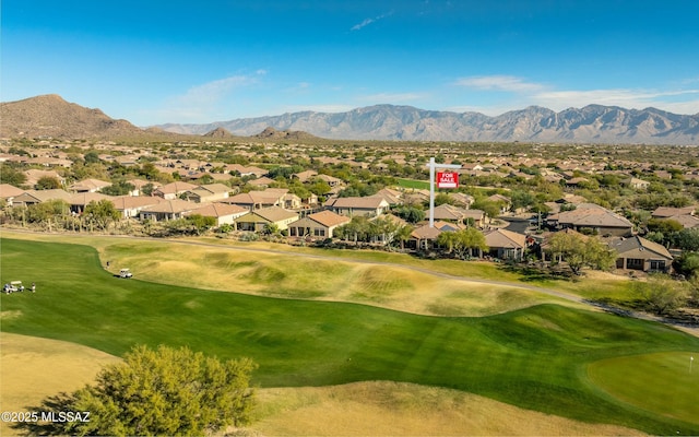 exterior space featuring view of golf course, a residential view, and a mountain view