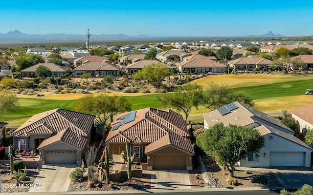 aerial view featuring a residential view, a mountain view, and golf course view