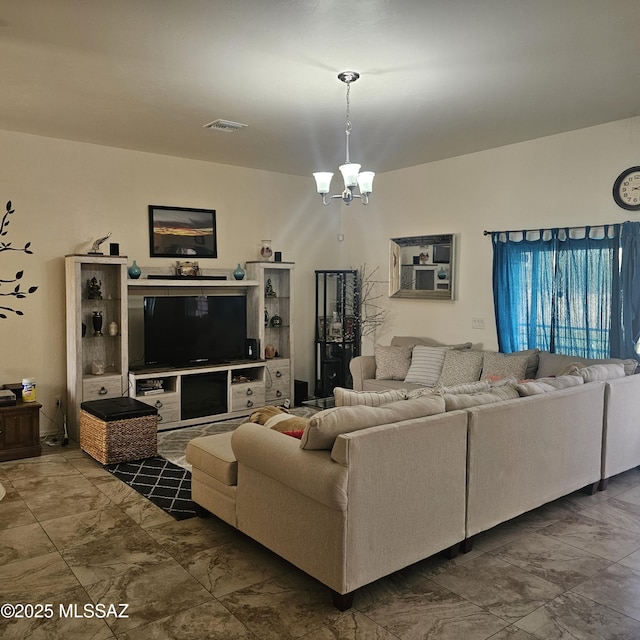 living room featuring a notable chandelier