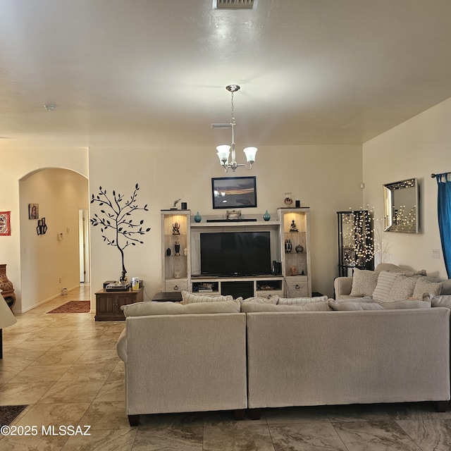 living room featuring a chandelier