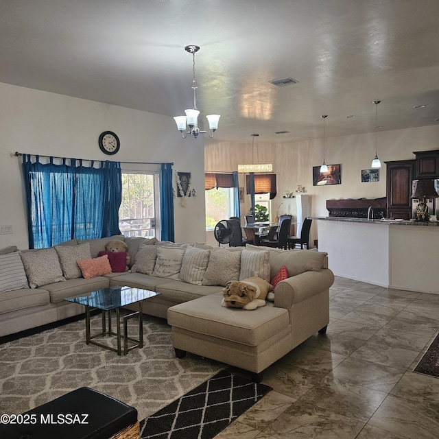 living room with a notable chandelier