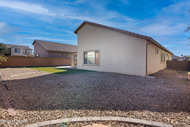 rear view of property featuring a patio