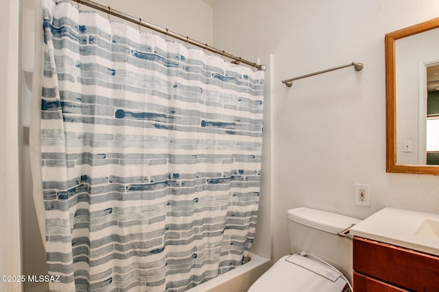 full bathroom featuring vanity, shower / tub combo, and toilet