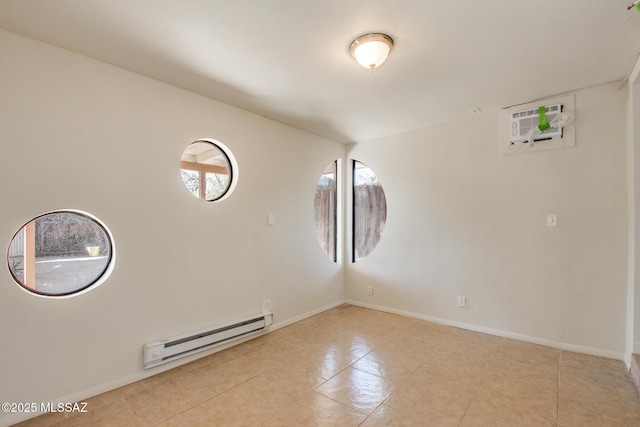 spare room with a wall mounted AC and a baseboard heating unit