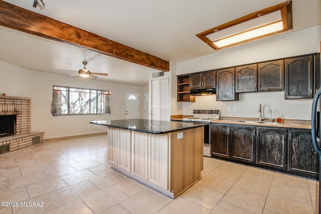 kitchen featuring sink, white electric range oven, a brick fireplace, dark brown cabinets, and beam ceiling